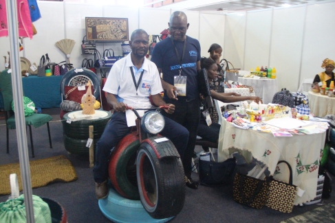 Mr Savanhu showing off his tyre made bike. Pic By Chris Tabvura