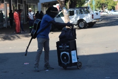Pardon Ndlovu captured selling his DVDs in the streets. Pic Chris Tabvura