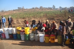 Bulawayo residents desperately waiting for their turn to get water at a borehole. Pic by Chris Tabvura