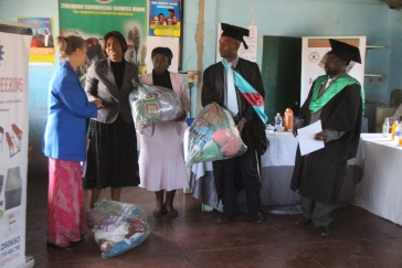 National Aids Council Director Mrs Sinatra Nyathi and Vulindlela's Patricia Tshabalala receiving blankets while Ndlovu and Tabvura look on