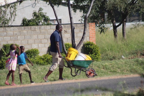 A Nkulumane father captured going to look for water from community boreholes. Pic by Chris Tabvura