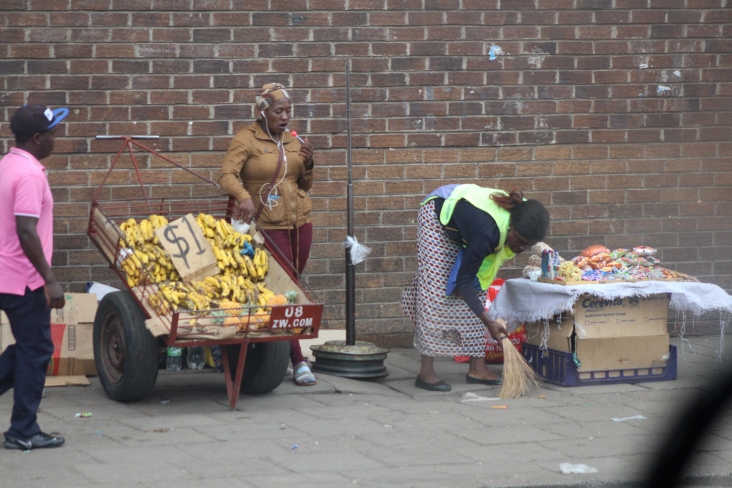 vendors clearing their place for business in Bulawayo. Pic by Chrispen Tabvura