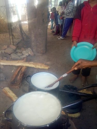 Food prepared from fire wood being served in Bulawayo recently.
