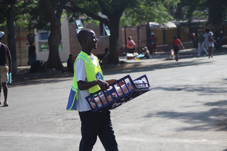 Smartly dressed vendor selling bread in the streets of Bulawayo. Pic by Chrispen Tabvura